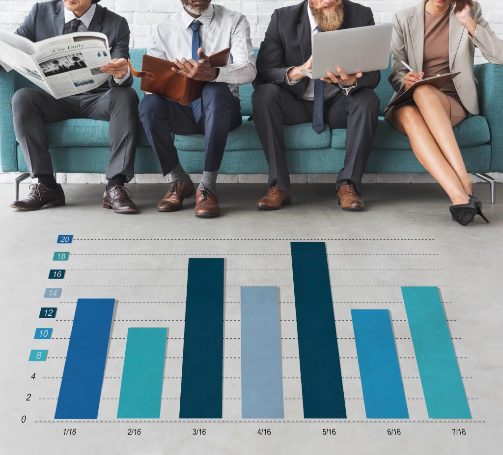 Business professionals seated in a row with a bar chart overlay